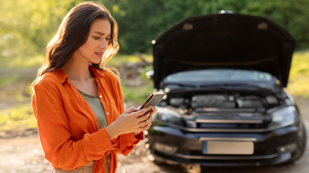 Woman with broken down car